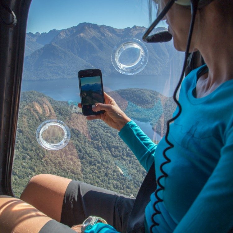 Capture the scene on your camera as you fly above Te Anaus hidden lakes