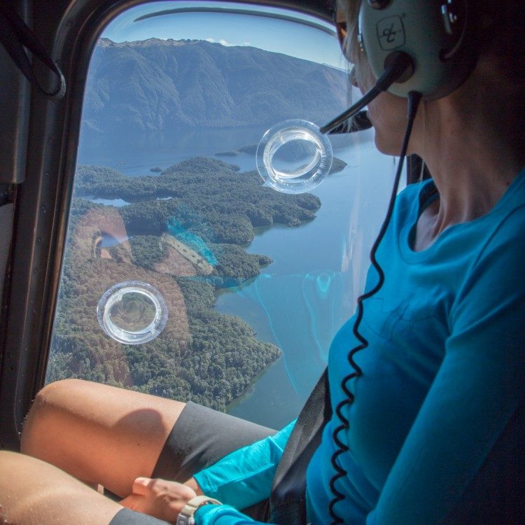 Fly by helicopter over scenic Lake Te Anau to the Kepler Track