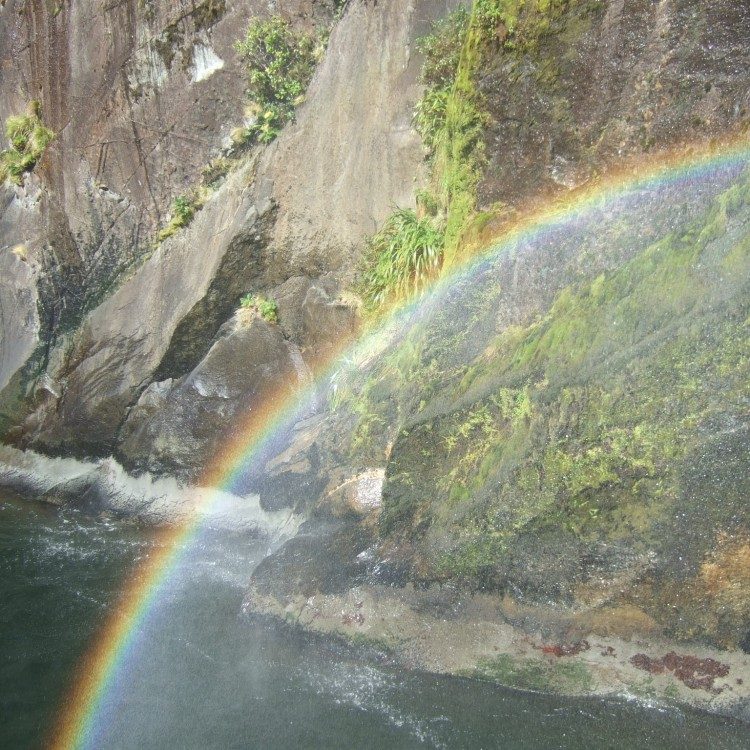Rainbows under the waterfalls on Milford Sound